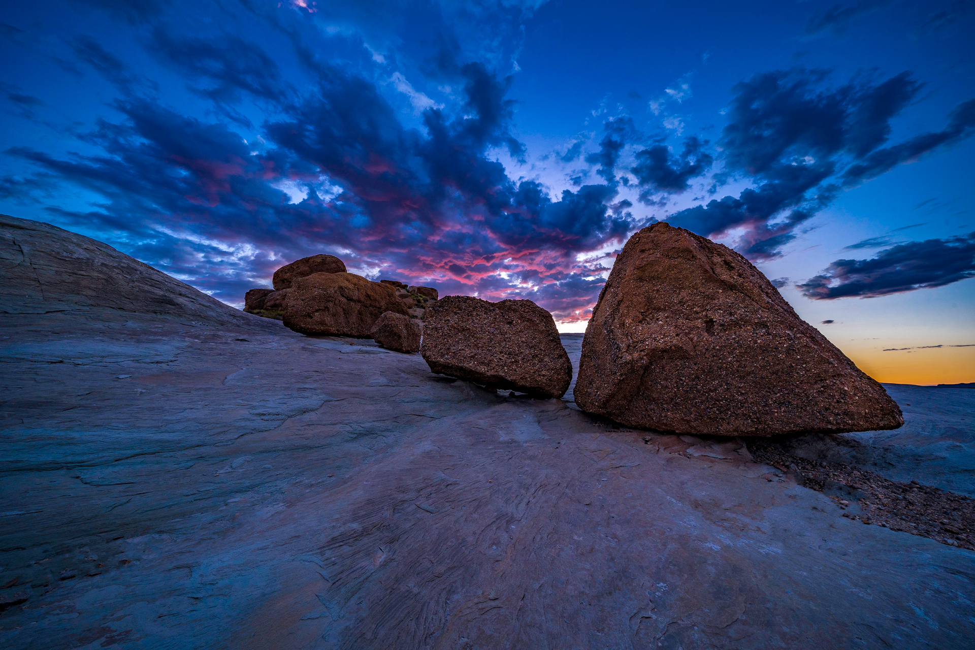 This minimalist image captured by Frisco, Colorado&rsquo;s Clark Schiring of Wilderness Exclusives Fine Art Photography, has an impressively pink sunset sky, making this landscape image and minimalist image with smooth and rough textures, showcasing Arizona&rsquo;s amazing landscape, a very calming work of art. Shot with a Sony wide-angle lens.