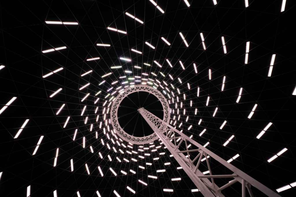 Clark Schiring of Wilderness Exclusives fine art photography took this image of the Spokane Pavilion at night. This is a unique geometric design, and creates a mind-bending illusion of dozens or hundreds of lights all swirling towards the top of the Pavilion. It fills the viewer's mind with wonder, as to what we are looking at, it appears to be a geometric pattern in the night sky.